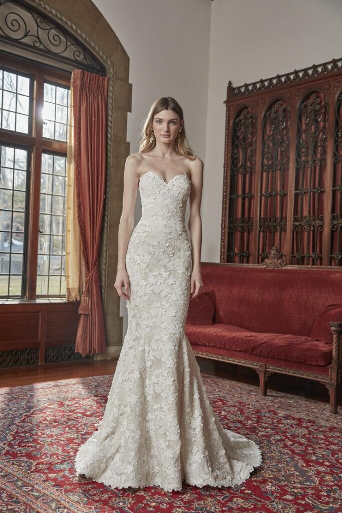 Strapless sweetheart mermaid wedding gown covered in 3D floral lace appliqué at La Mariée Boutique Tulsa