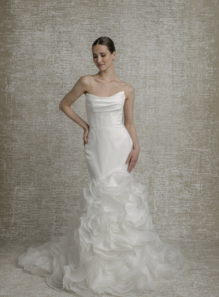 Strapless satin mermaid wedding gown with a draped bodice and cascading organza ruffle skirt at La Mariée Boutique Tulsa