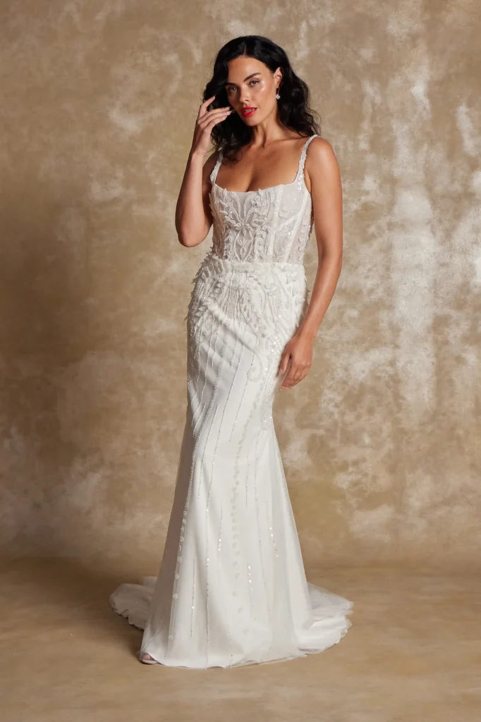 Square-neck spaghetti strap fit and flair wedding gown with intricate beaded and sequin embroidery at La Mariée Boutique Tulsa