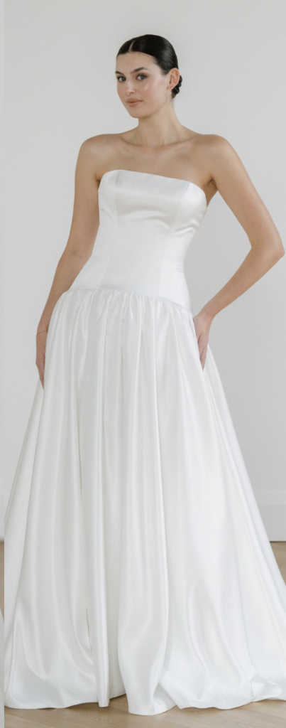 Clean strapless satin drop-waist ball gown wedding dress with a gathered full skirt at La Mariée Boutique Tulsa